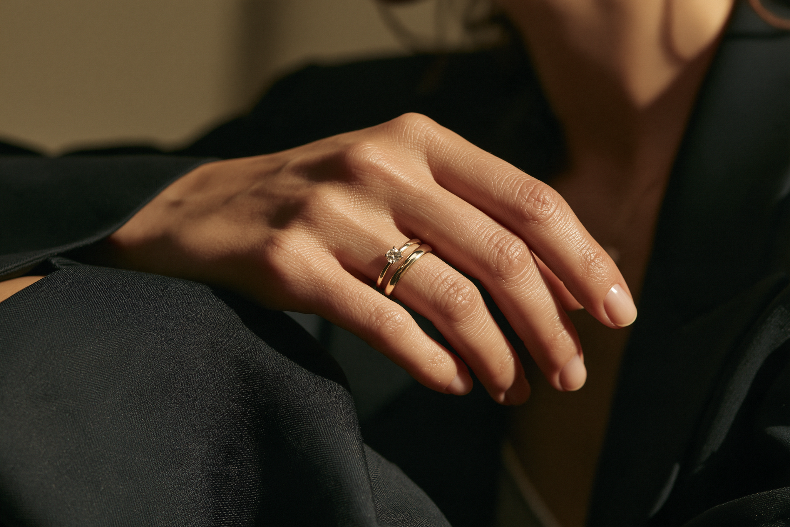 Elegant solitaire ring paired with a simple gold wedding band