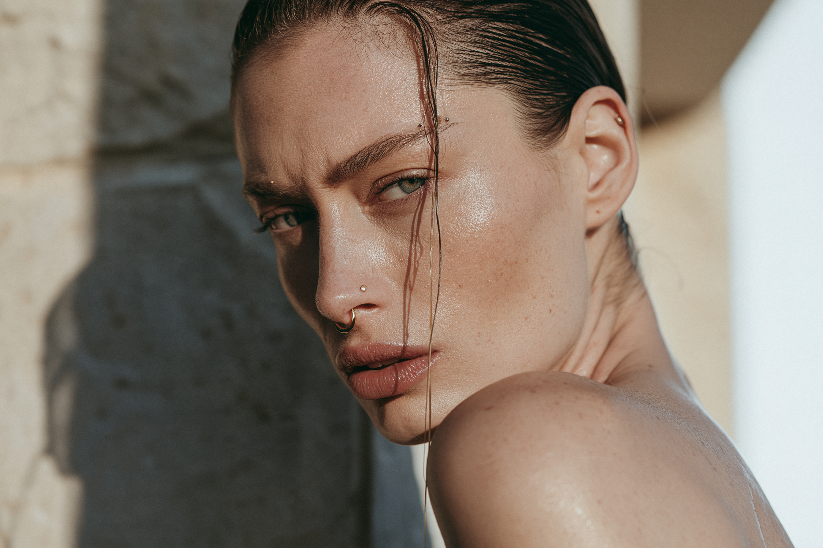 Modern woman wearing nostril, septum and minimal facial piercings